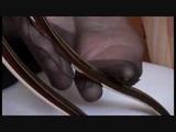 dangling in reinforced pantyhose in bed